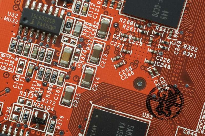 Close view of a circuit board showing chips, tracks and soldered components